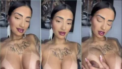 youtuber Amanda Souza mostrando sus grandes pechos adornados con piercings en los pezones
