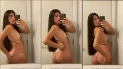 Alana Gelmi, toda delgada, mostrando su tanga frente al espejo