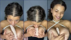 Gigi Vip, una joven mujer, realizando una práctica erótica con un juguete entre sus senos