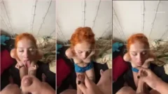 Pequeña pelirroja safada disfrutando de un bocado en el escondite del criminal del barrio